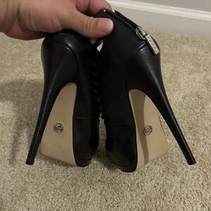 Bebe caged heel. Black heels with a sexy modern twist.